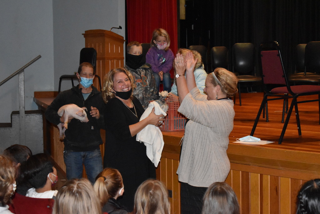 Mrs. Damisch kisses a chicken!